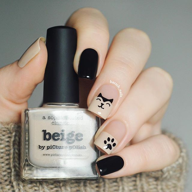 nude and black nail design with cats