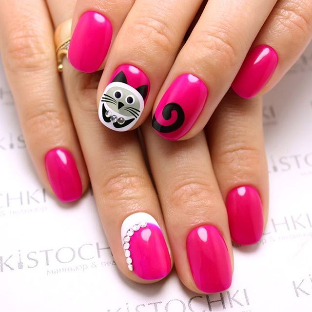 pink nail art with kittens