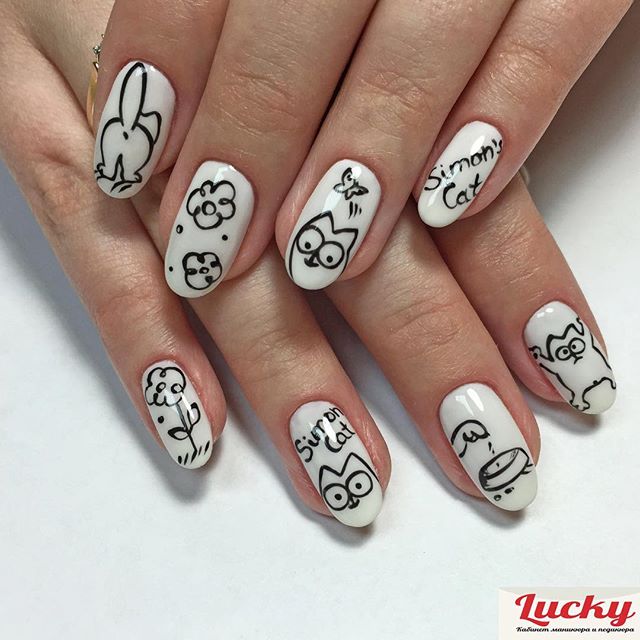 white nail art with funny cat designs