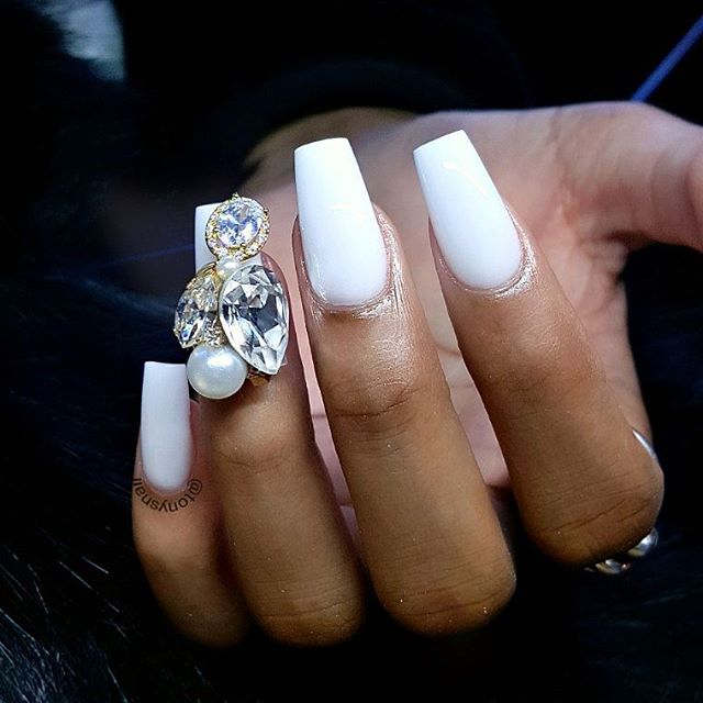 white manicure with big gemstones