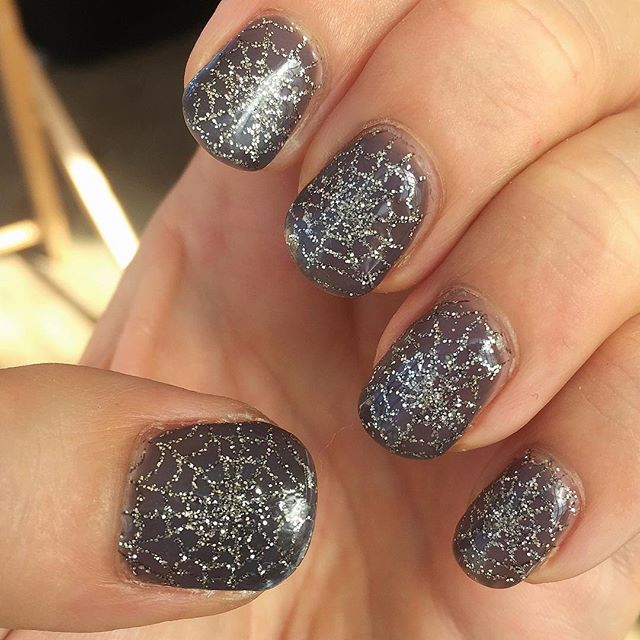 manicure with silver spider web