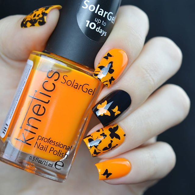 black and orange halloween butterfly nail design