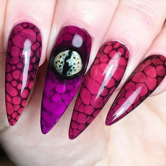 Halloween nail art with snake`s skin