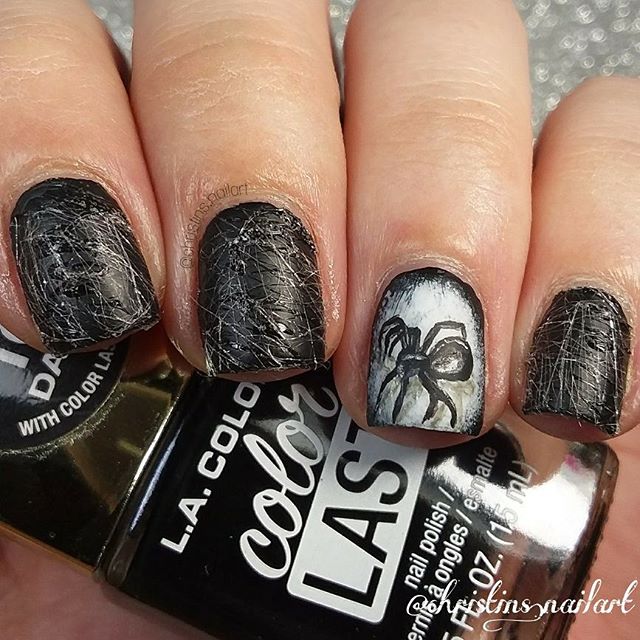 halloween manicure with a realistic 3D spider web and a spider