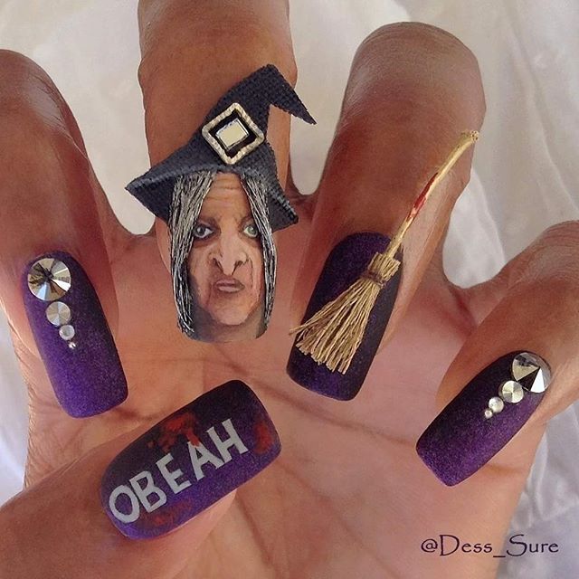 purple halloween nails with a broom and a witch