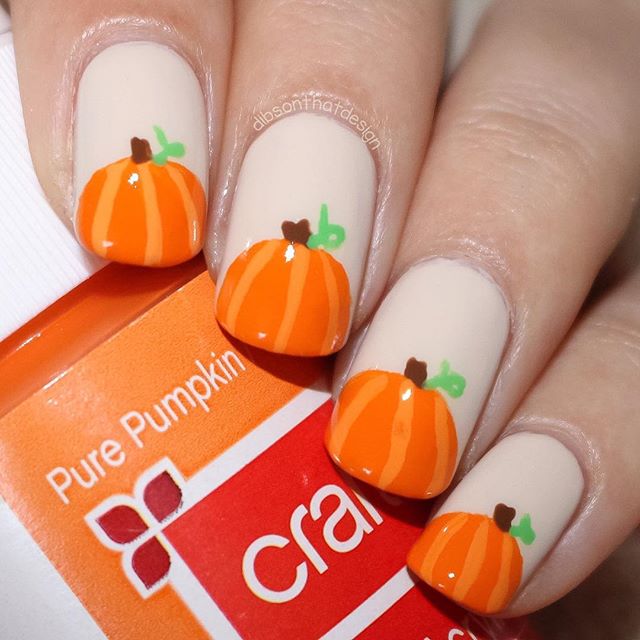 beige manicure with pumpkin for Halloween