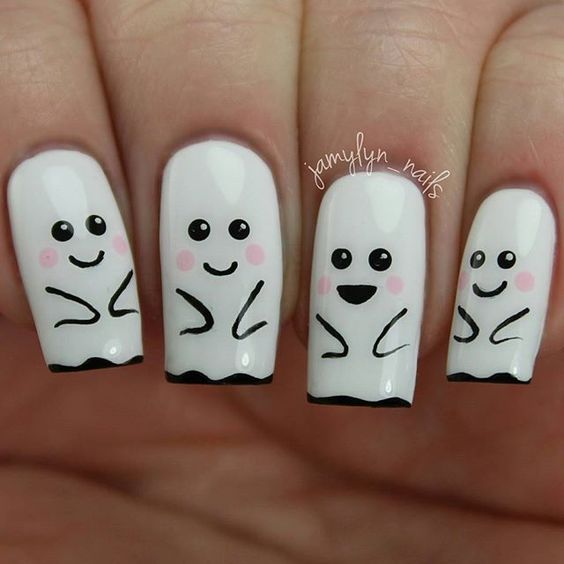 cute halloween nails with white ghosts