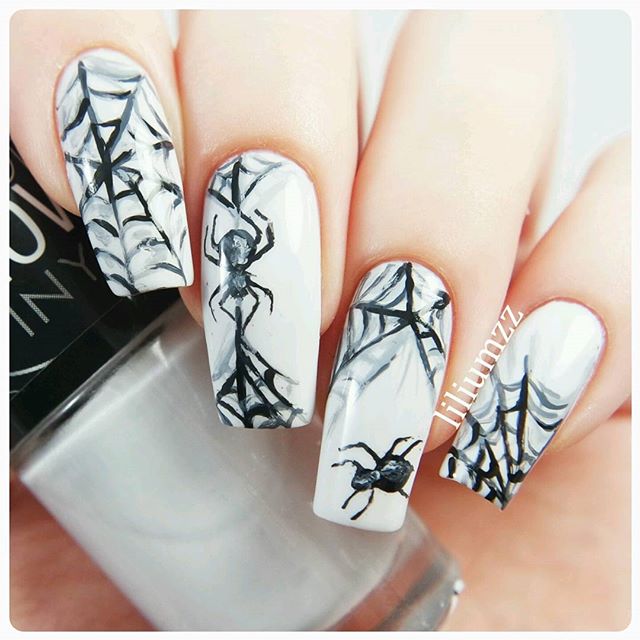 white spider nail art design
