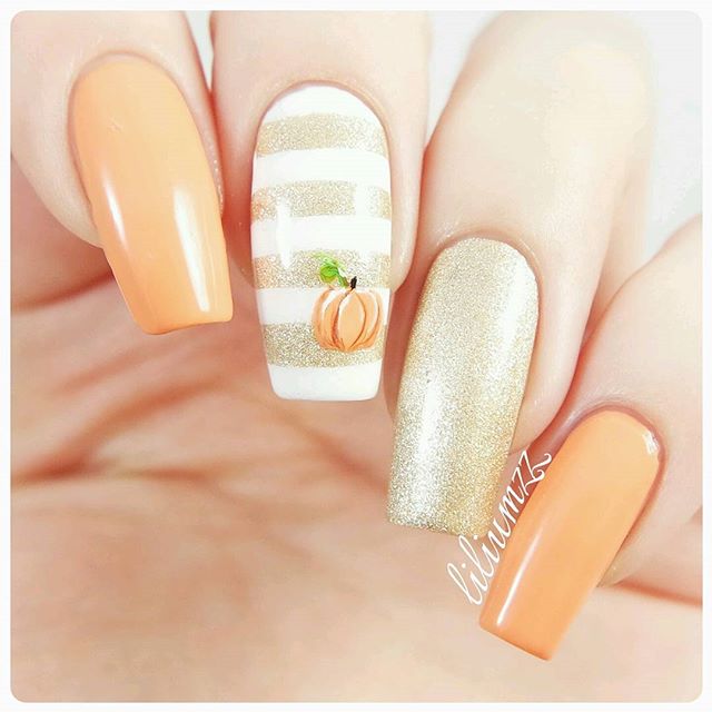 pastel nail art with halloween pumpkin