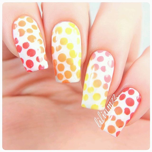 white halloween nails with colorful dots