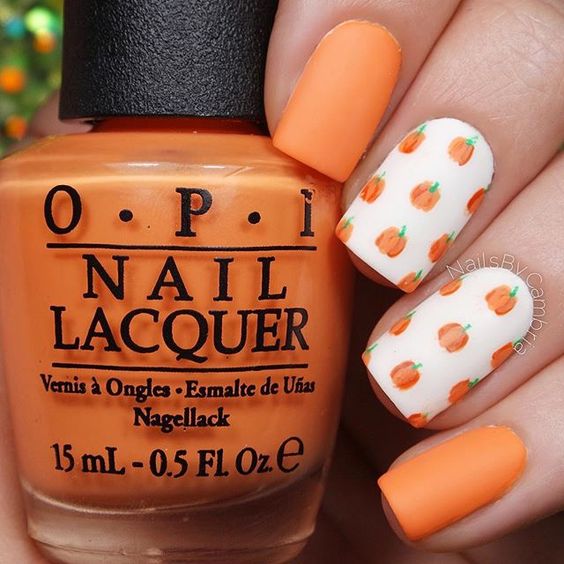 white and orange nail design pumpkin