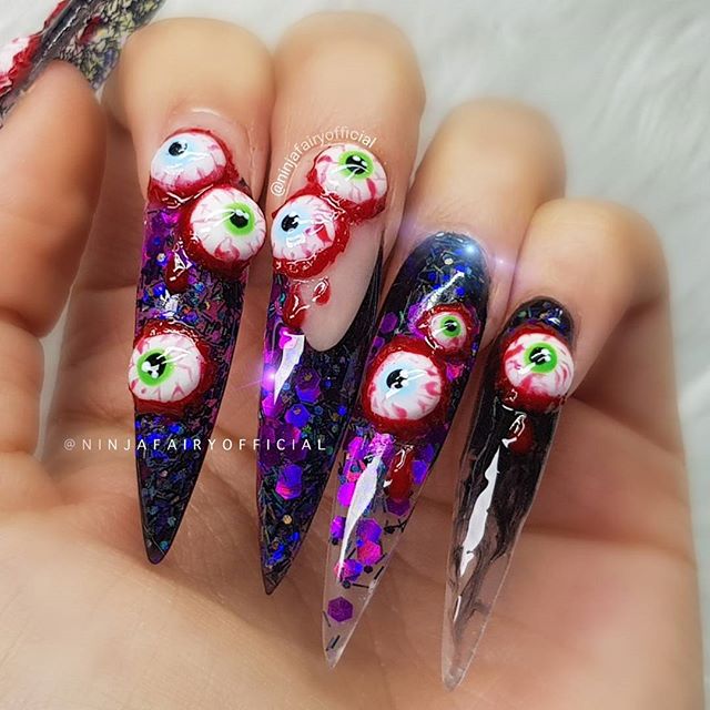 long Halloween acrylic nails with 3D eyes